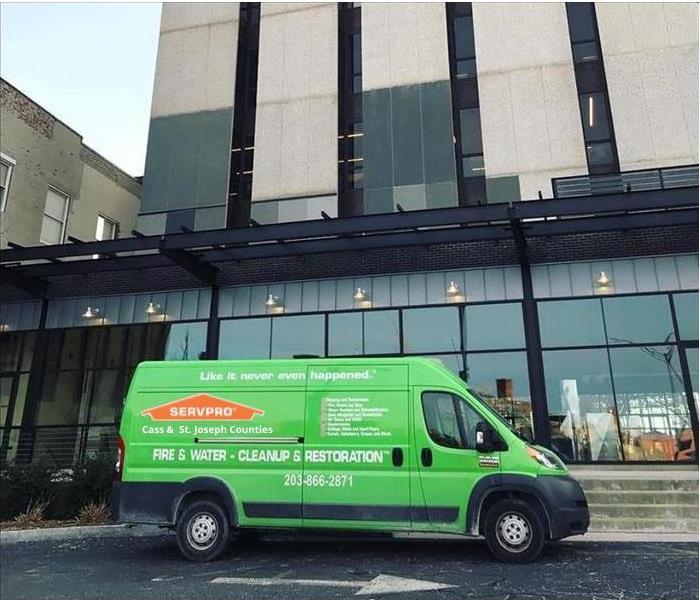 SERVPRO van in front of very tall building